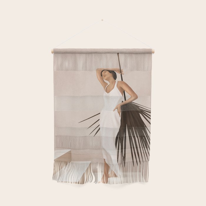Minimal Woman With A Palm Leaf Wall Hanging