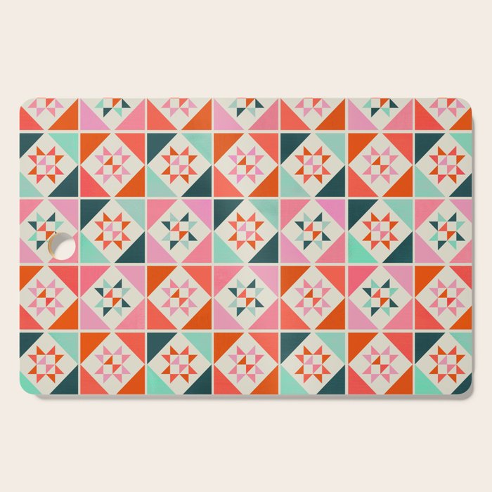 Festive Quilt Pattern In Pink, Red And Green Cutting Board