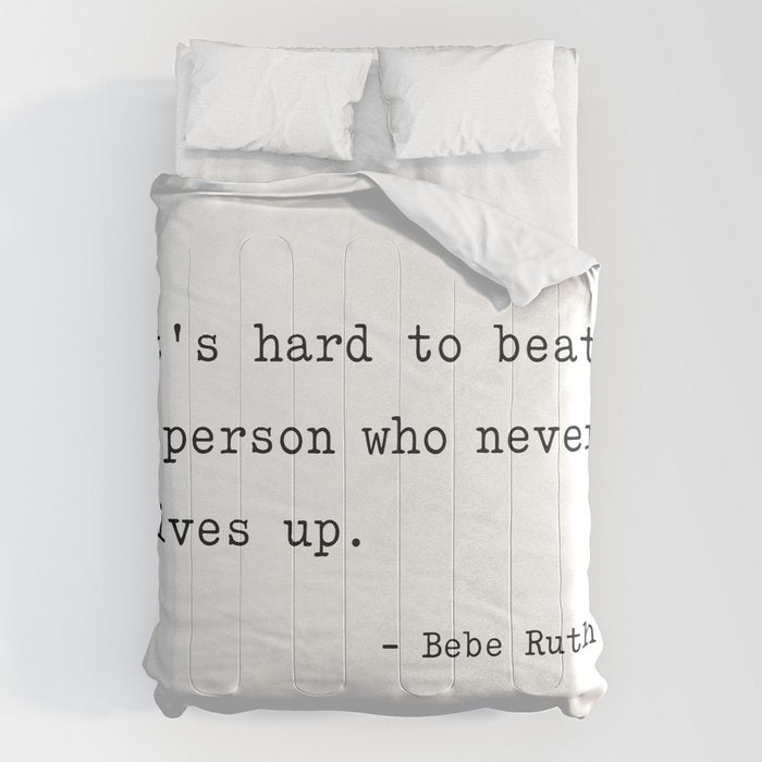 It Is Hard To Beat A Person Who Never Gives Up Comforter