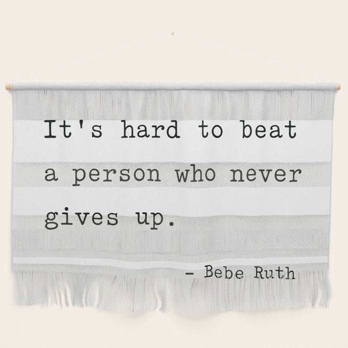 It Is Hard To Beat A Person Who Never Gives Up Wall Hanging