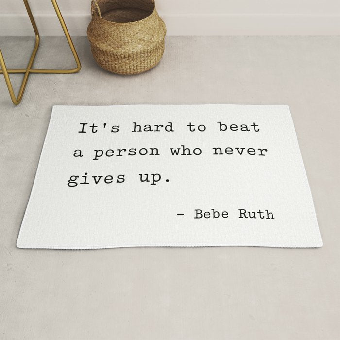 It Is Hard To Beat A Person Who Never Gives Up Rug