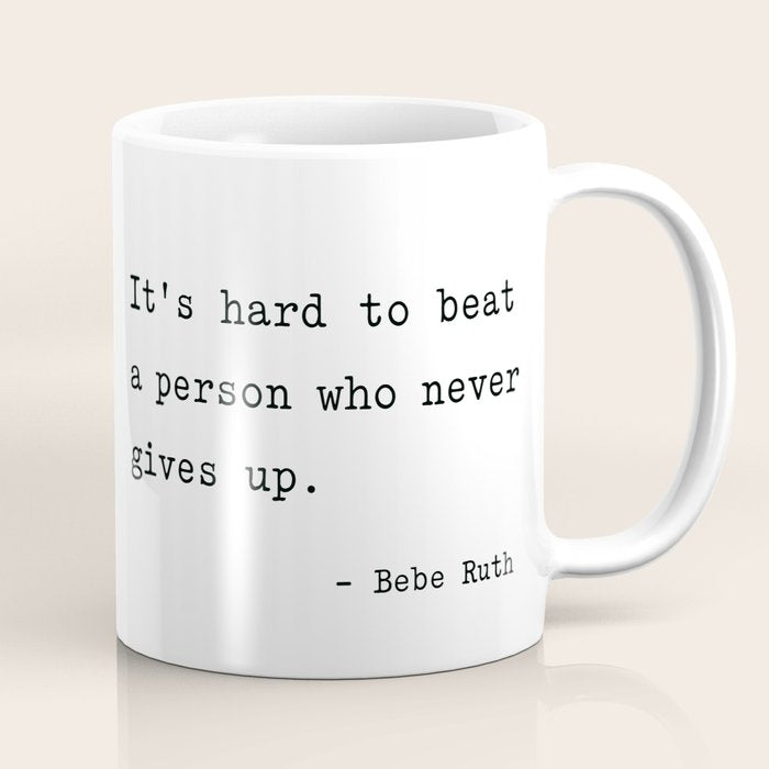 It Is Hard To Beat A Person Who Never Gives Up Coffee Mug